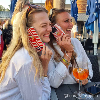 Girls enjoying Aperol Spritz with DOLCE phone cases