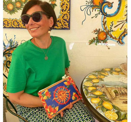 Model shows Taormina Purse with sunshine lemons oranges design at Bam Bar Taormina
