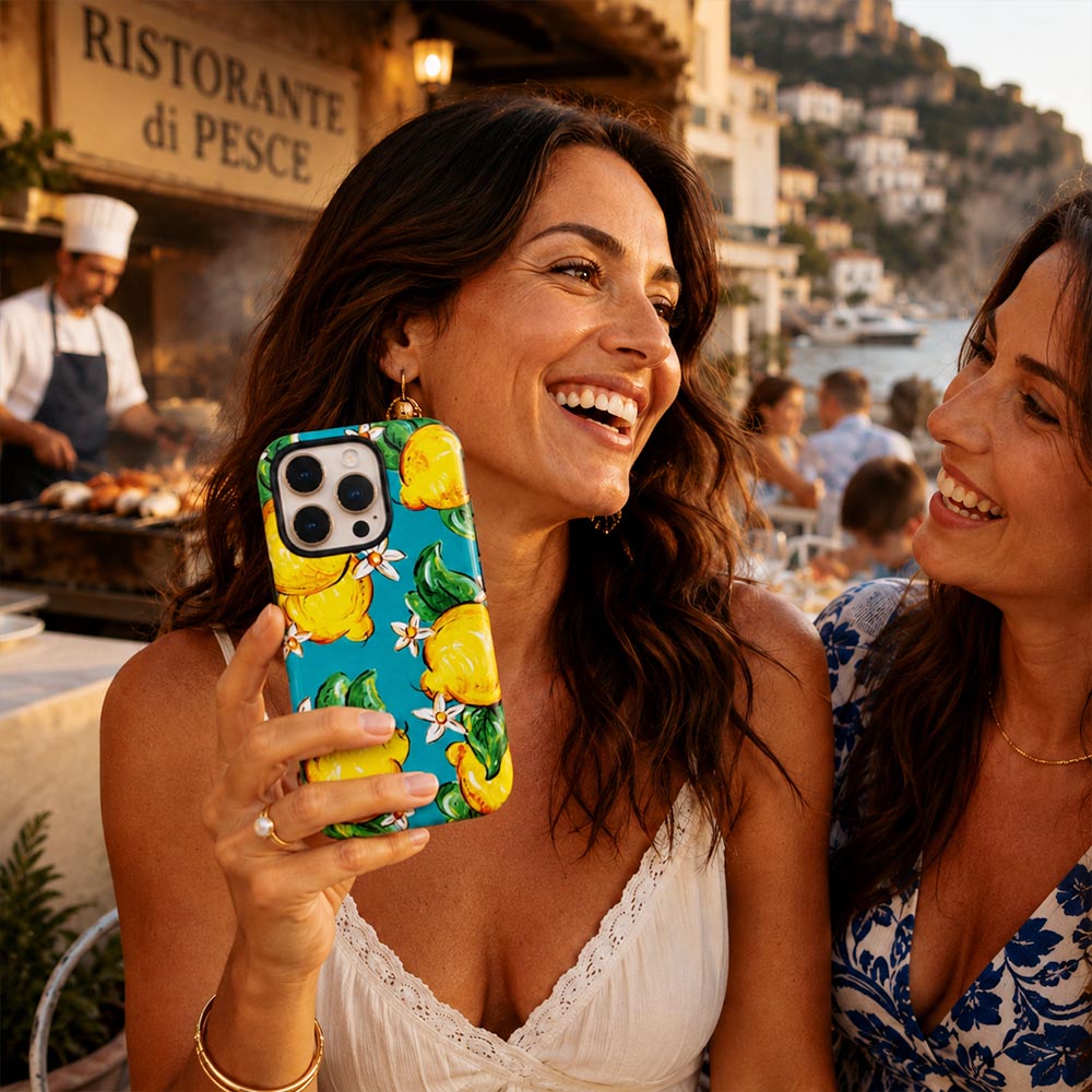 Gorgeous turquoise phone case with lemons held by brunette woman in Italy