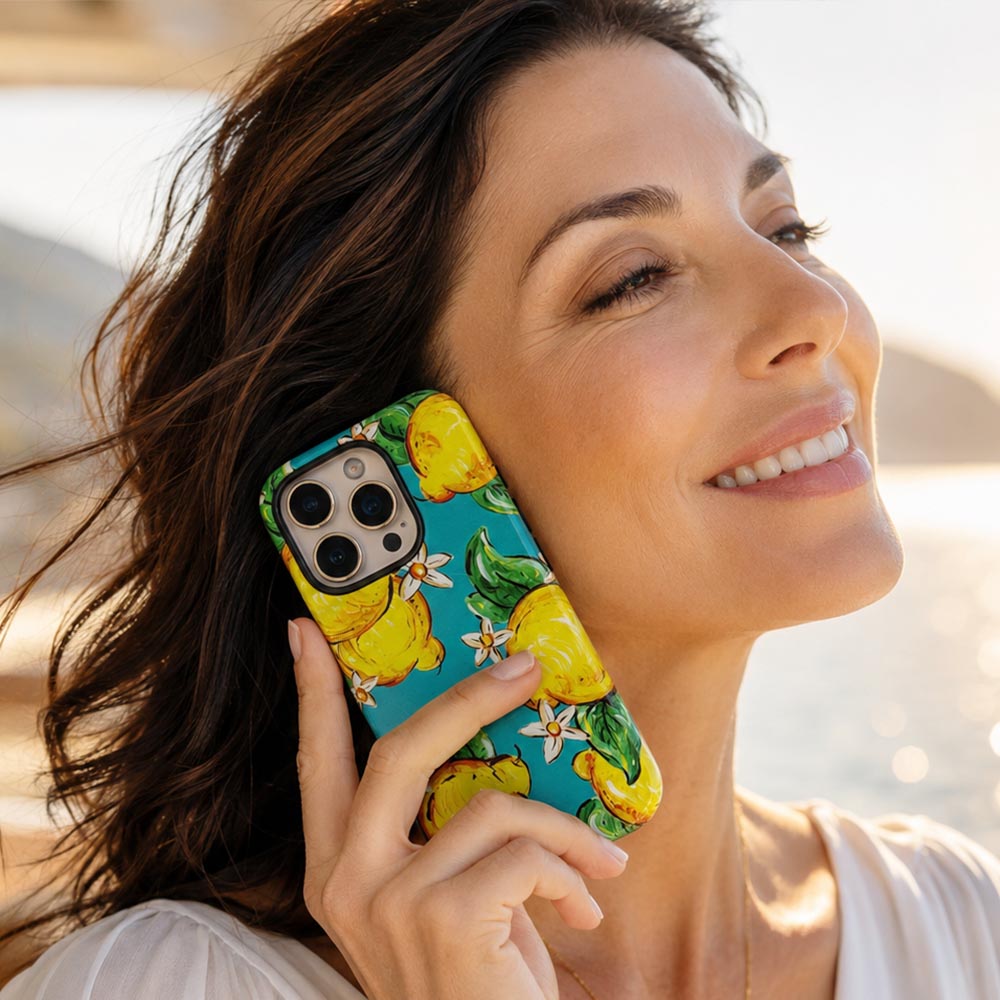 gorgeous woman holding lemon phone case to her ear