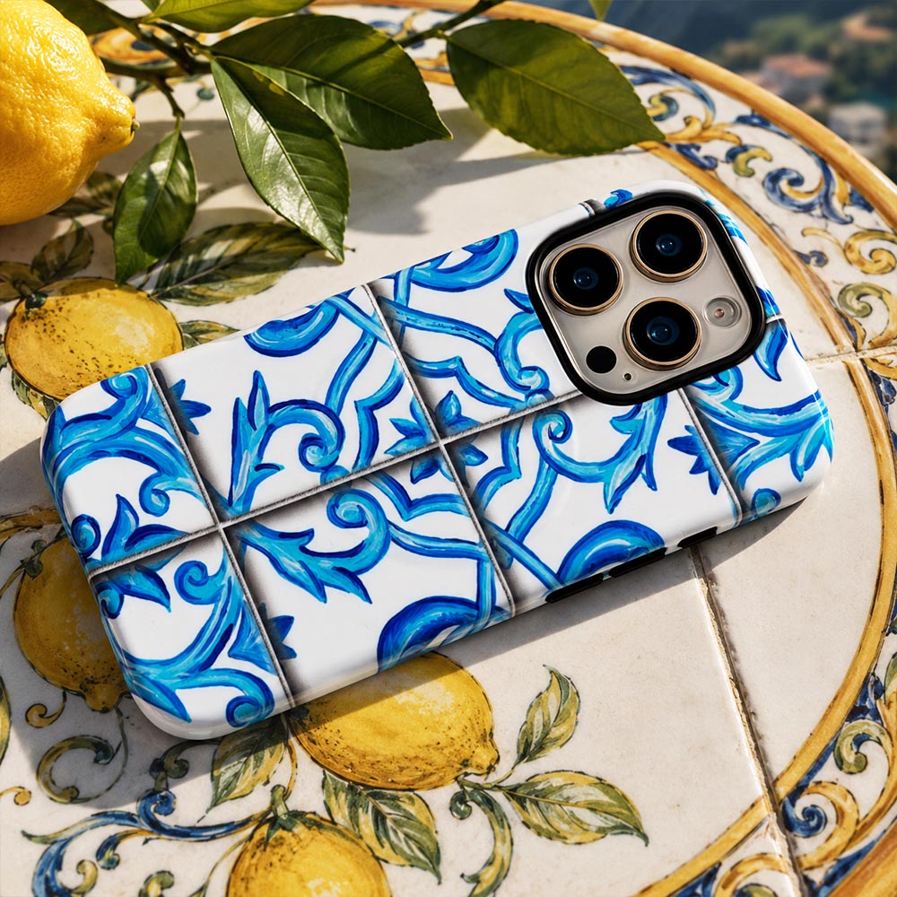 Luxurious blue tile design phone case on table in italian villa
