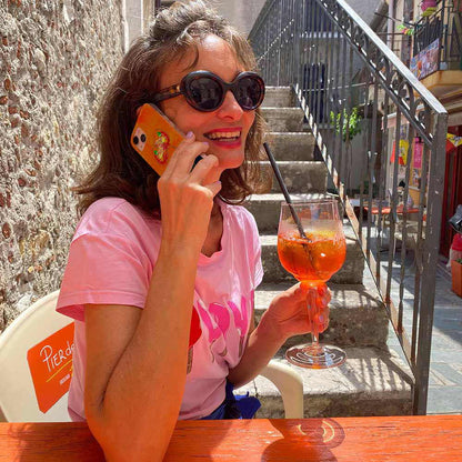 Model in Sicily with Aperol Spritz iPhone Case