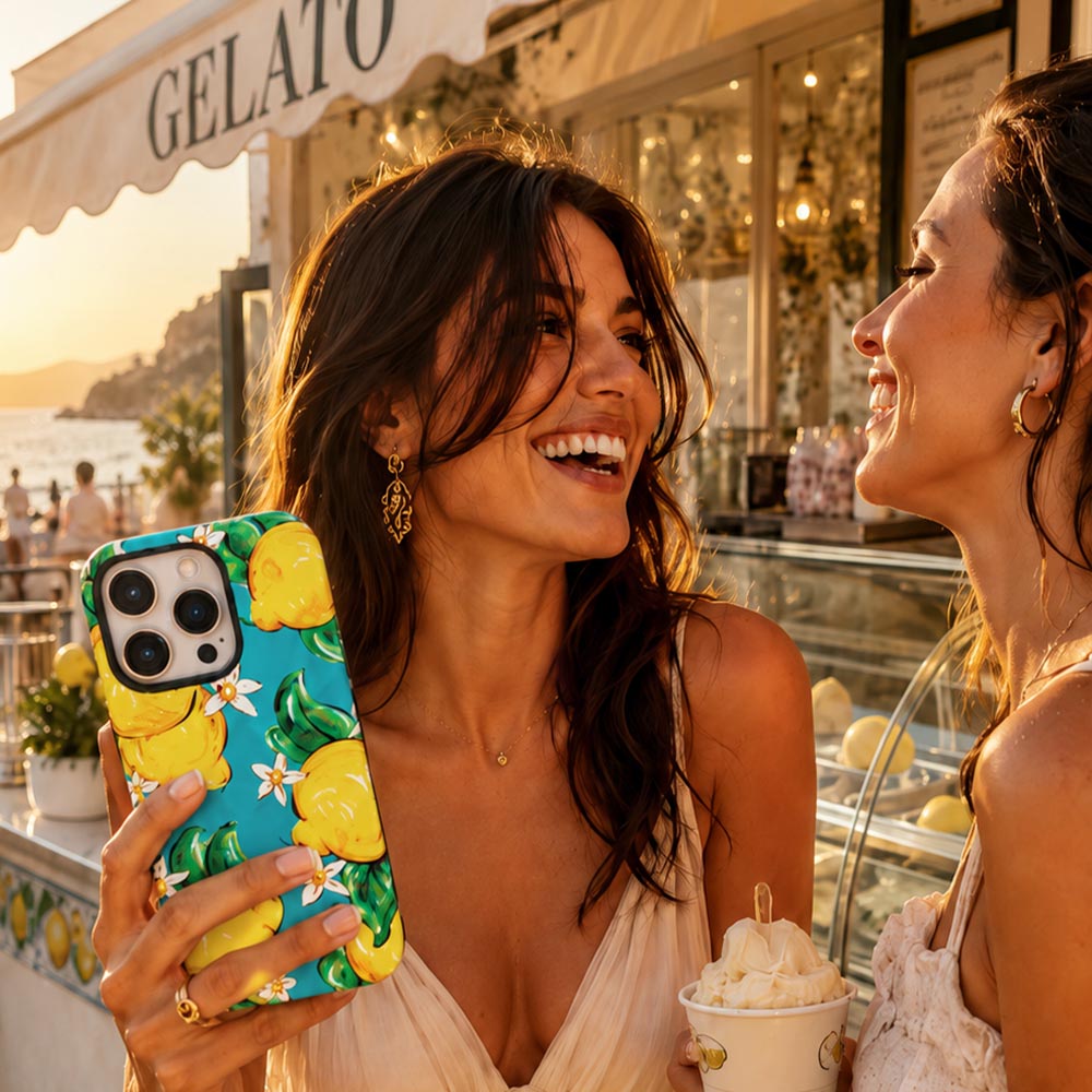 lemon and turquoise phone case held by young girl in Italy