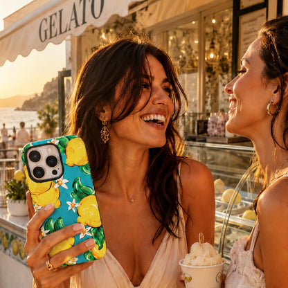 lemon and turquoise phone case held by young girl in Italy