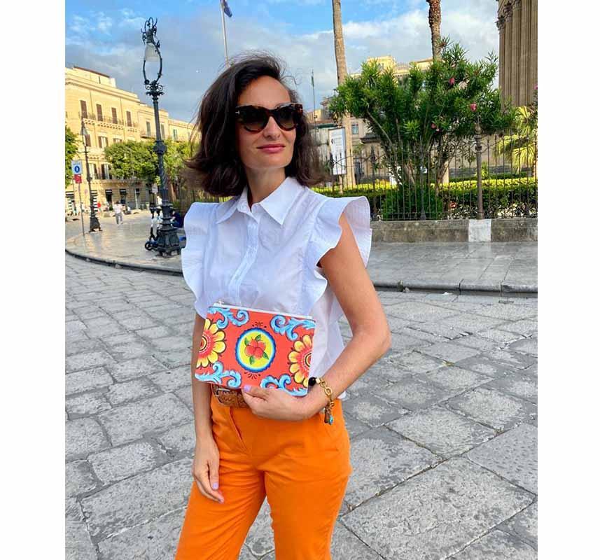 Orange and flower Italian pochette worn by model in Taormina Sicily