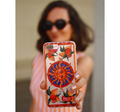 Phone Case - Taormina - Ceramic White Background Edition-traditional handpainted Italian Sicilian design with sun lemons oranges Bam Bar-DOLCE ITALIANA up close in front of girl in orange stripe dress