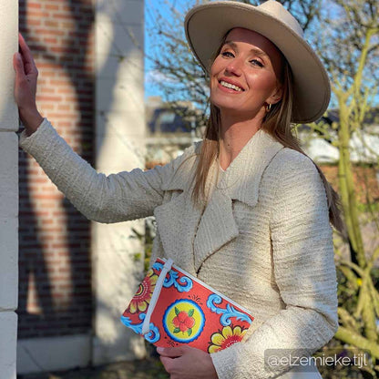 Dutch model Elze Mieke Tijl wears the Arancio Piana Clutch bag by DOLCE ITALIANA 2