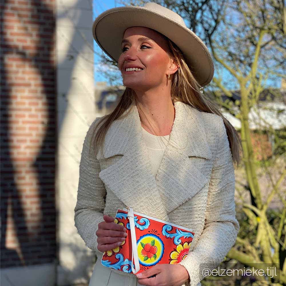 Dutch model Elze Mieke Tijl wears the Arancio Piana Clutch bag by DOLCE ITALIANA