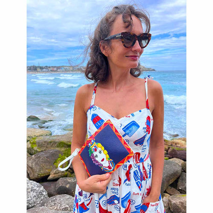 Model in dress wears Testa Di Moro Sicilian design purse by DOLCE ITALIANA